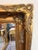An impressive rectangular mirror with a richly gilt, thick double frame, finely decorated with scrolling forms and foliate...