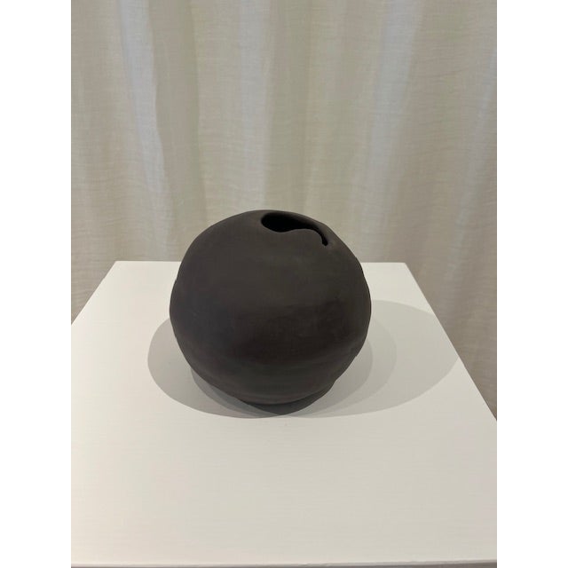 Dimensions: 6.5” diameter x 6” h Material: stoneware Finishing: unglazed Color: mushroom Edition: one-of-a-kind