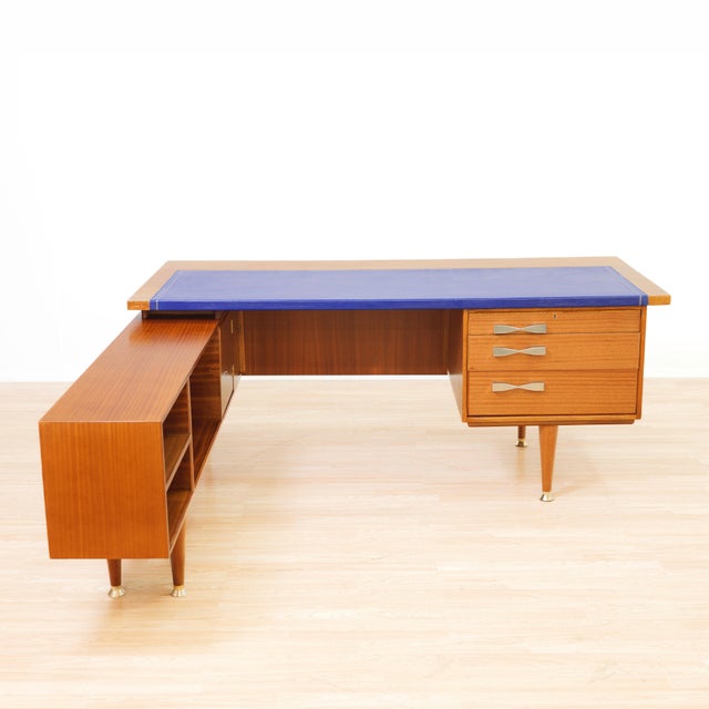 This exceptional mid-century executive desk combines elegant proportions with outstanding functionality. Crafted in richly...