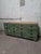 Robust vintage wooden drawer cabinet from a former workshop, finished with a deep green patina. Its long, low proportions...