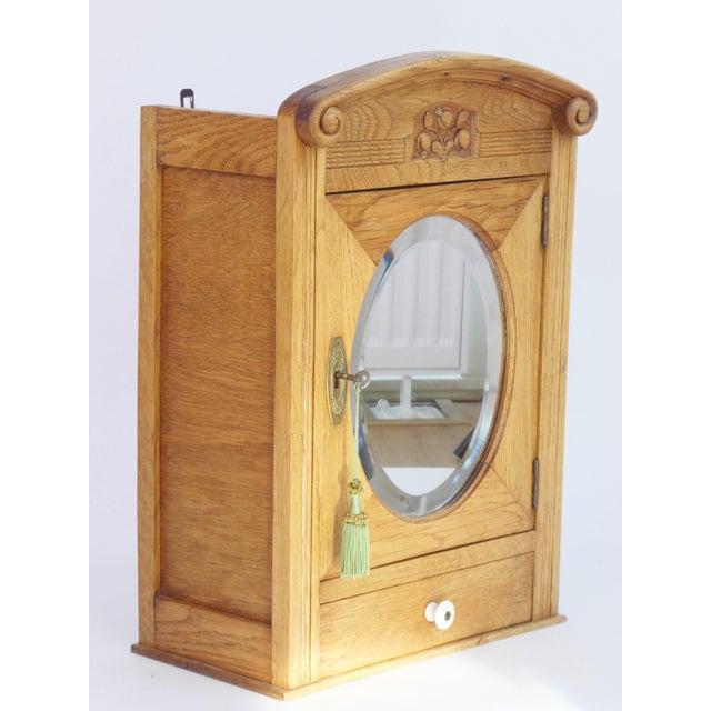 Small Art Deco Floral Carved Wooden Cabinet with Oval Beveled Mirror, 1920s For Sale - Image 3 of 8