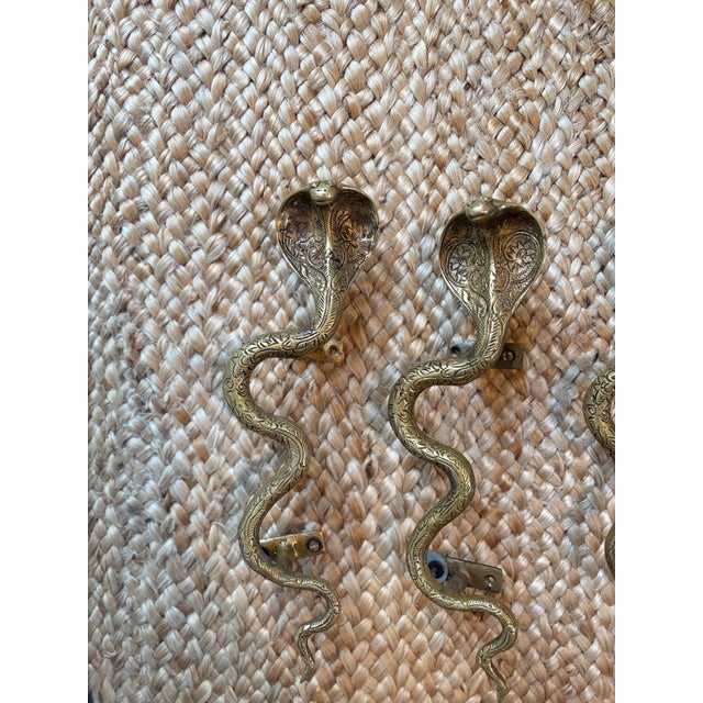 These classic brass snake handles make for a unique and whimsical cabinet or buffet handle.