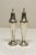 A pair of monogramed "M" weighted sterling silver salt and pepper shakers with screw-on lids, likely dating from the late...