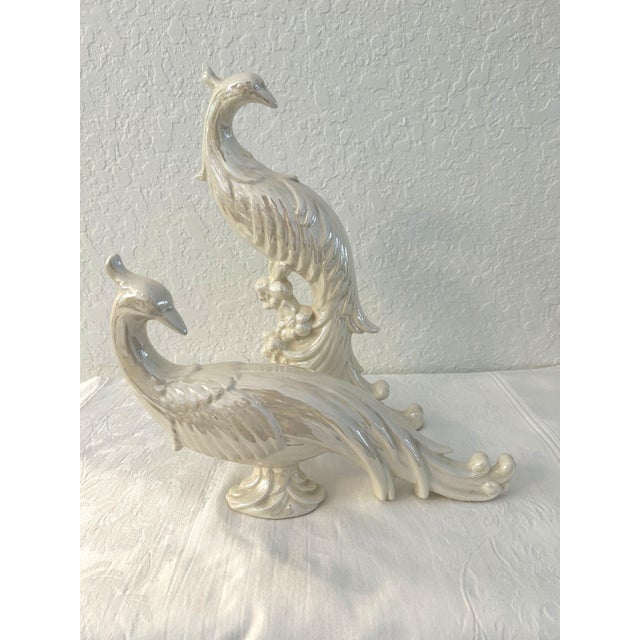 Lovely pair of regal Mid-Century ceramic pheasant figurines in a white iridescent lusterware high-gloss finish. No maker's...