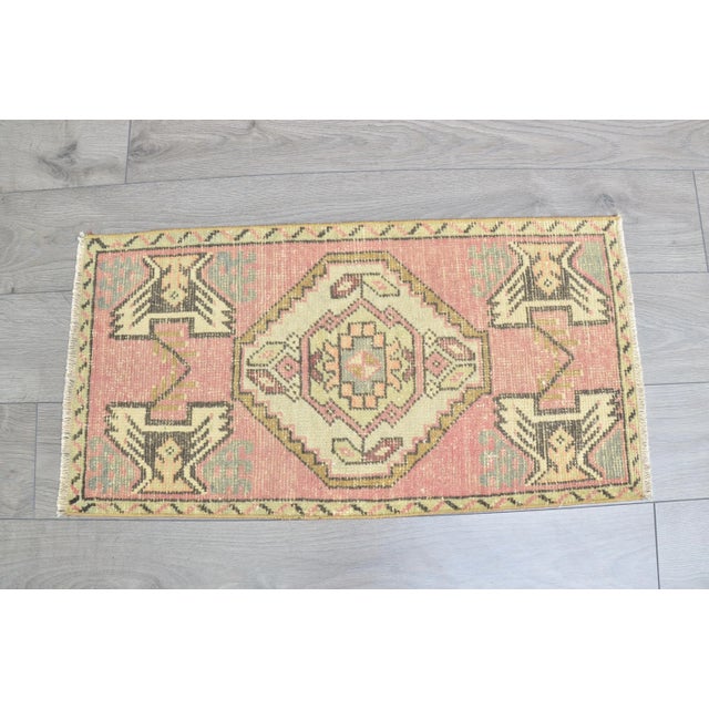 This is a vintage Turkish Oushak rug from the 1960s. The piece was hand-knotted.