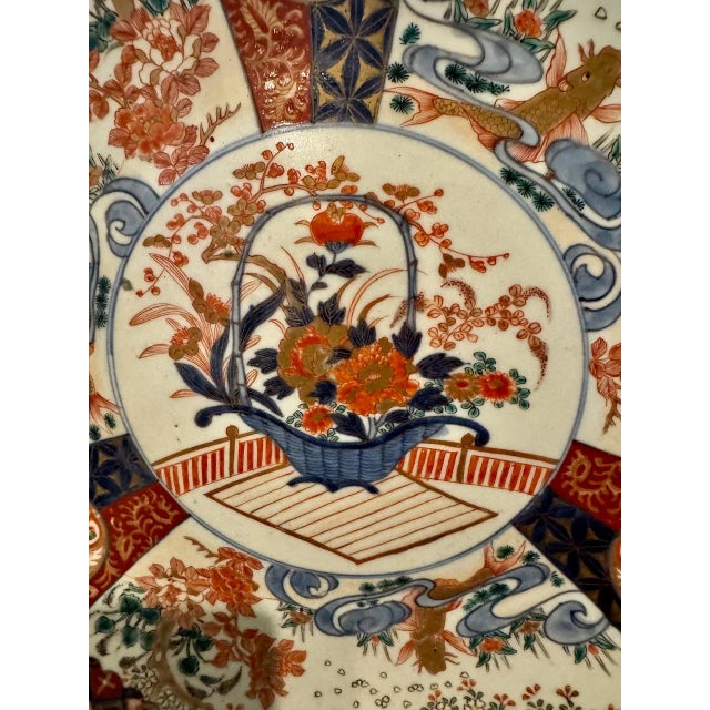 This impressive large Imari Charger dates to the later Meiji period. The charger features a central reserve of a...