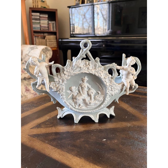 Selling this Vintage/Antique Bisque Planter featuring cherubs and flowers. I cannot find a marking to identify the brand,...