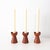 This set of candlesticks were designed and manufactured in Denmark during the 1960s. They are made of teak and impress...