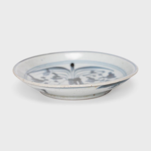 An everyday example of Chinese blue-and-white ceramics, this petite footed dish from the late 19th century charms with...