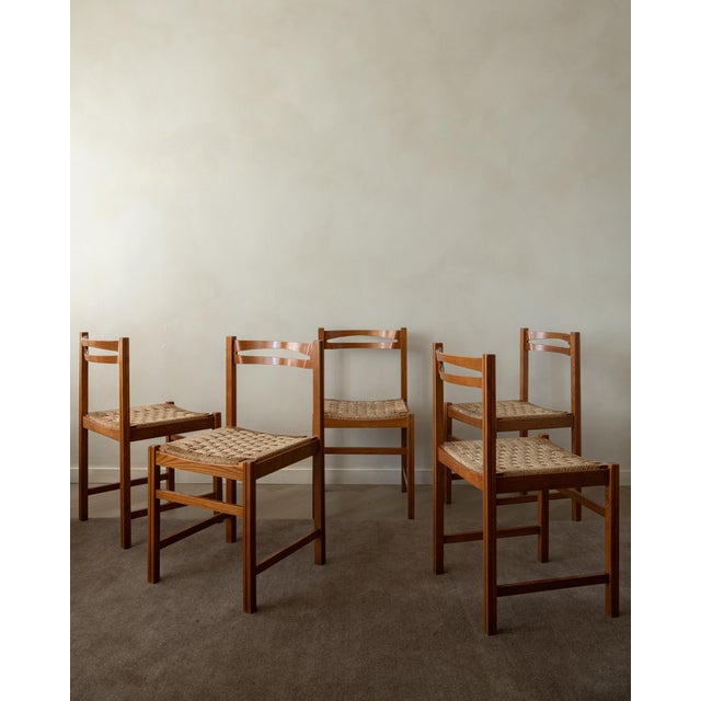 A vintage italian dining chair set in lacquered wood and woven paper cord, made by snaidero and produced in italy during...
