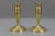 Pair of antique French Empire-style gilt brass candlesticks from ca. 1890. A beautiful and compact-sized pair of French...