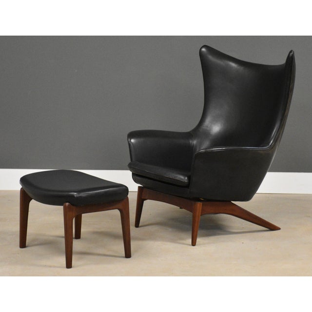 A mid century modern black leather lounge chair and ottoman made by HW Klein. Made in Denmark. Circa 1960’s....