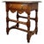 A beautifully crafted early 20th century oak side table in the Chippendale style, dating to circa 1910, showcasing the...
