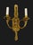 Empire style candlelight’s in the form of a hunting horn mounted on a tassel swag. Gilded bright gold brass.