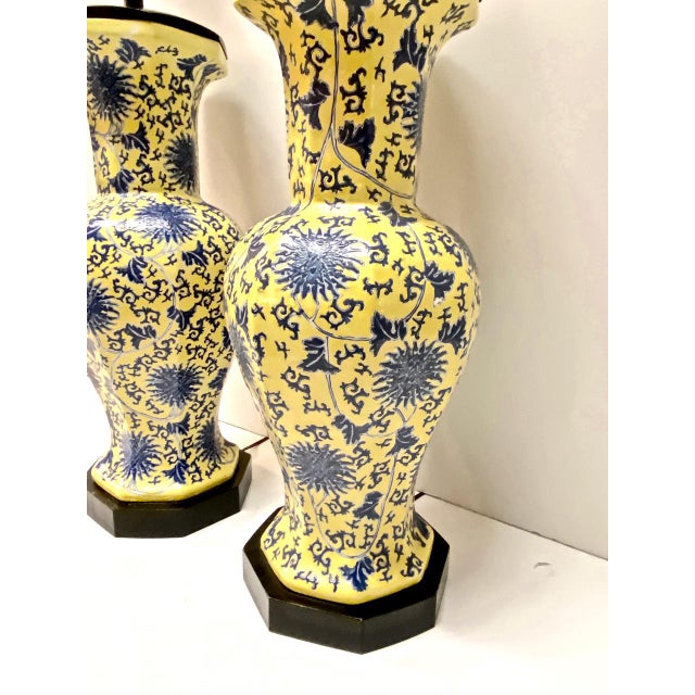 This is an exceptional pair of blue and yellow porcelain chinoiserie table lamps that date to the second half of the 20th...