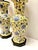 This is an exceptional pair of blue and yellow porcelain chinoiserie table lamps that date to the second half of the 20th...
