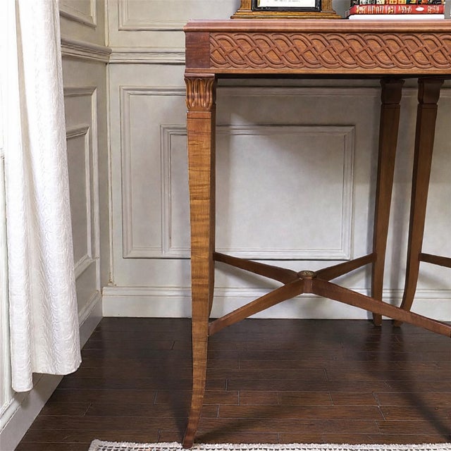 Dating to the late 1920s–1930s, this elegant pair of mahogany end tables reflects Neoclassical revival influence,...