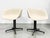 Set of four vintage Eames molded fiberglass chairs for Herman Miller, including two armchairs and two armless side chairs....
