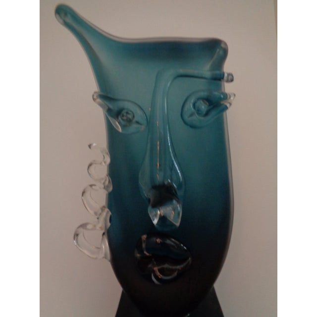 A modern abstract glass sculpture of a face by Romanian artist Ion Tamaian. It looks fantastic and is one of a kind....