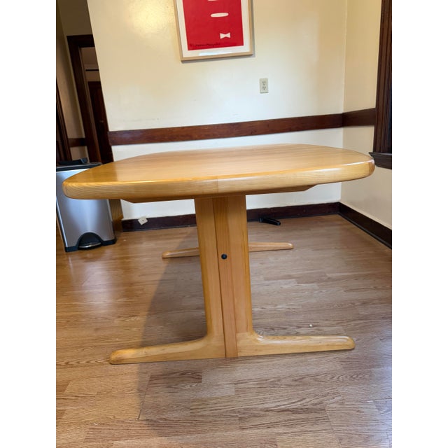 A sleek and stylish mid-century Danish Modern sculpted solid oak extension dining table By Skovby Møbelfabrik Denmark,...