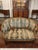 Antique French giltwood salon seating set dating to circa 1900, consisting of one settee and four matching armchairs. The...