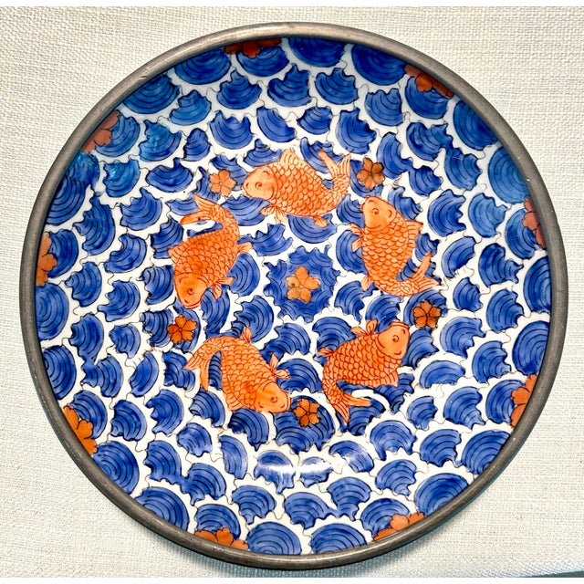 Elegant Mid-Century Modern Neiman Marcus pewter and porcelain koi fish plates and bowls featuring sculptural metal...
