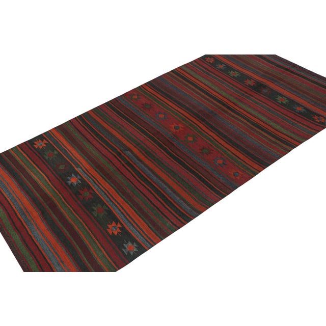 This vintage 5x10 Persian Kilim is a tribal rug of Varamin provenance. Handwoven in wool, it originates circa 1950-1960....