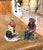 Charming and full of character, this pair of antique cast iron bookends features two seated figures dressed in traditional...