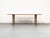 A delicate Danish coffee table by France & Søn. It is made of solid teak with tapered edges and slender, tapered legs....