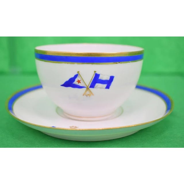 This is a teacup and saucer set that features yacht club burgee motifs. The pieces date back to the 1930s. Cup: 2.25"H x...