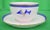 This is a teacup and saucer set that features yacht club burgee motifs. The pieces date back to the 1930s. Cup: 2.25"H x...
