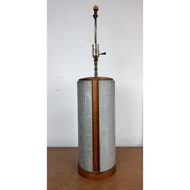 A striking mid-century table lamp made from original curved letterpress printing plates used to print The Wall Street...