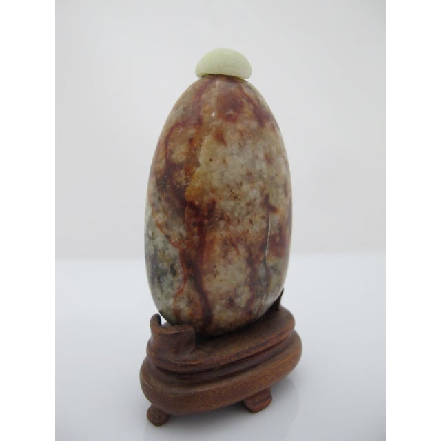 Antique Chinese Pebble form snuff bottle. Polished, naturally patterned russet tone Jasper stone bottle with dome polished...