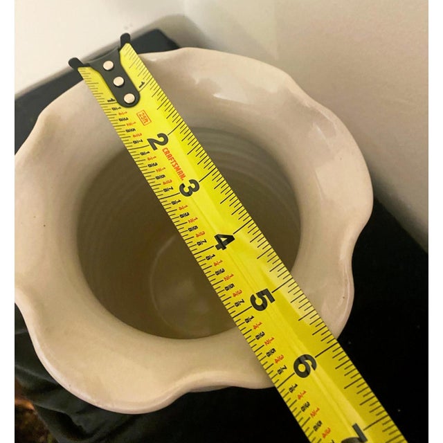 Add a touch of classic country charm to your home with this hand-turned stoneware vase from Shakers & Thangs Pottery in...