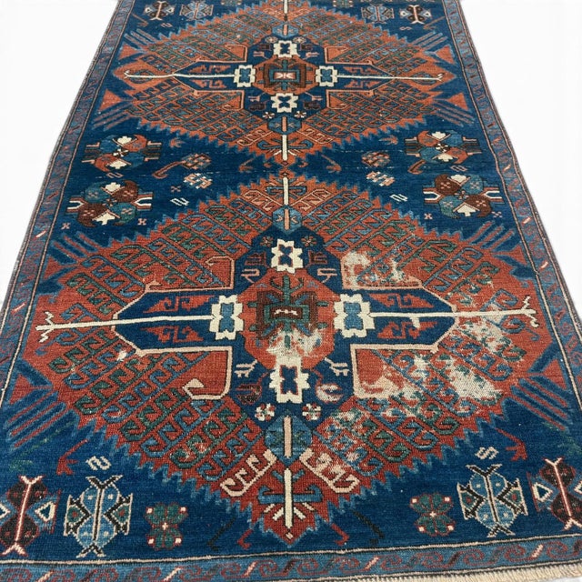 This antique Kazak rug is a striking example of the powerful geometric language and rich symbolism characteristic of...