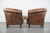 We are offering this set of two sturdy vintage sheepskin club chairs with a beautiful patina. These delightful sheepskin...
