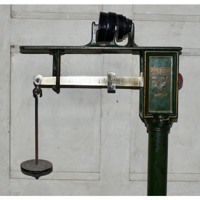 A rare set of sumerling & co ltd sack scales. These scales are in antique condition, made from cast iron, with the weights...