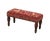 Meticulously handcrafted in the United Kingdom, this upholstered stool boasts classic studding and hand-polished solid...