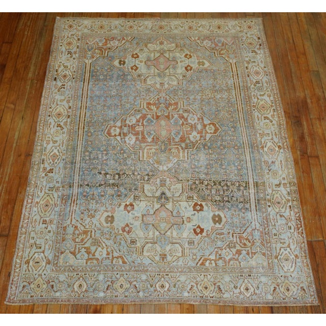 A late 19th Century wool on cotton superfine wool scatter Size Persian Senneh Rug with a geometric design on a sky blue...