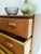 Vintage Danish teak chest of drawers from the 1950s with four drawers and integrated handles, featuring an elegant...