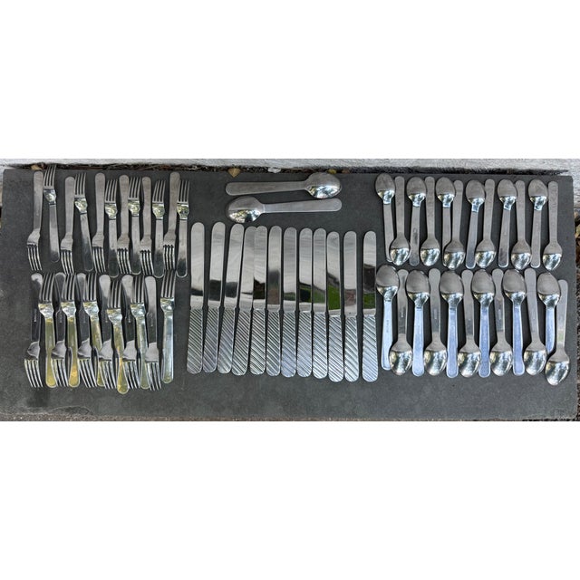 76 piece flatware set for 12 place settings plus extras manufacturer by Stanley Roberts. The pattern is called “Zebra”....