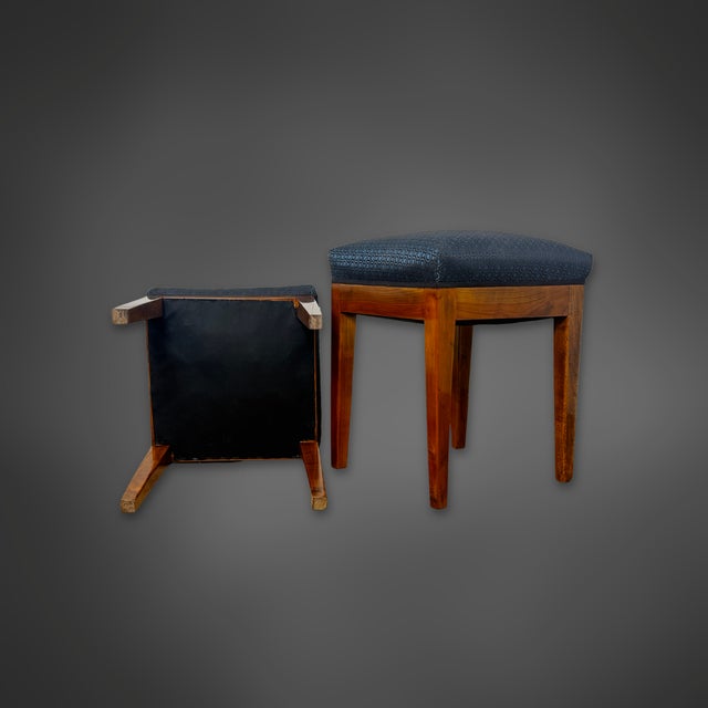 A beautiful pair of stools from the Biedermeier period, circa 1825, crafted from solid cherry wood. The clean lines, warm...