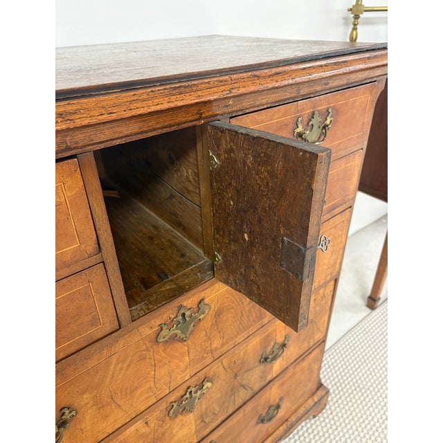 An exceptional English 18th-century George I burl walnut chest-on-chest of rare proportions. This stately piece features a...