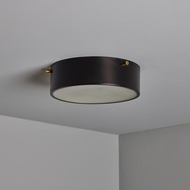 1960s Round Black Metal and Opaline Glass Ceiling Lamp by Bruno Gatta for Stilnovo A quintessentially 1960s Italian design...