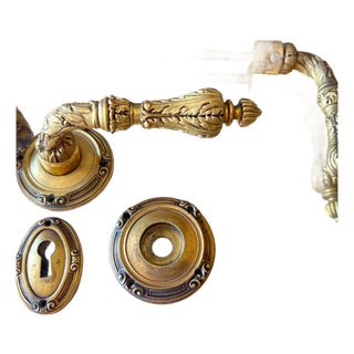 Pair of Sherle Wagner-style lever door handles / doorknobs and escutcheons // vintage hardware for French doors // cast brass with gilt For Sale