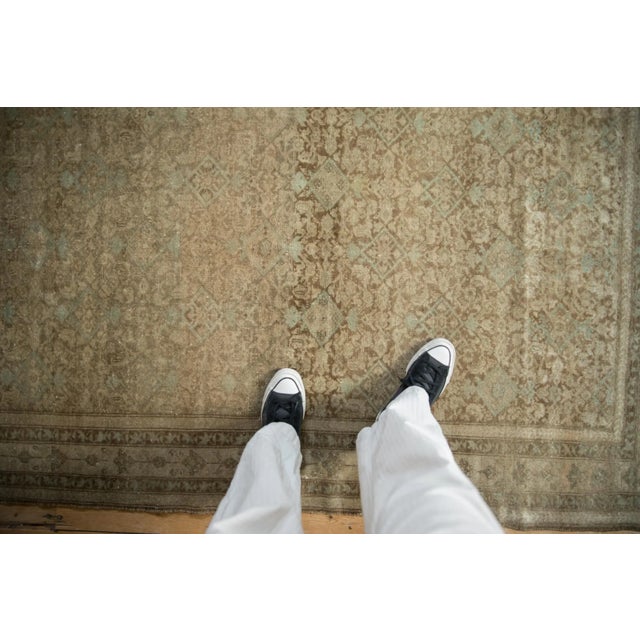 :: Covered field in an allover Herati design motif with abrashes across. Colors and shades include: Oxidized silver, pale...