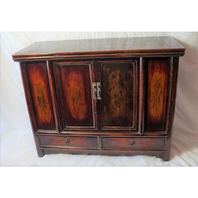 This pretty antique cabinet has the clean lines and elegance of the Ming Dynasty traditions.It is made of panel...