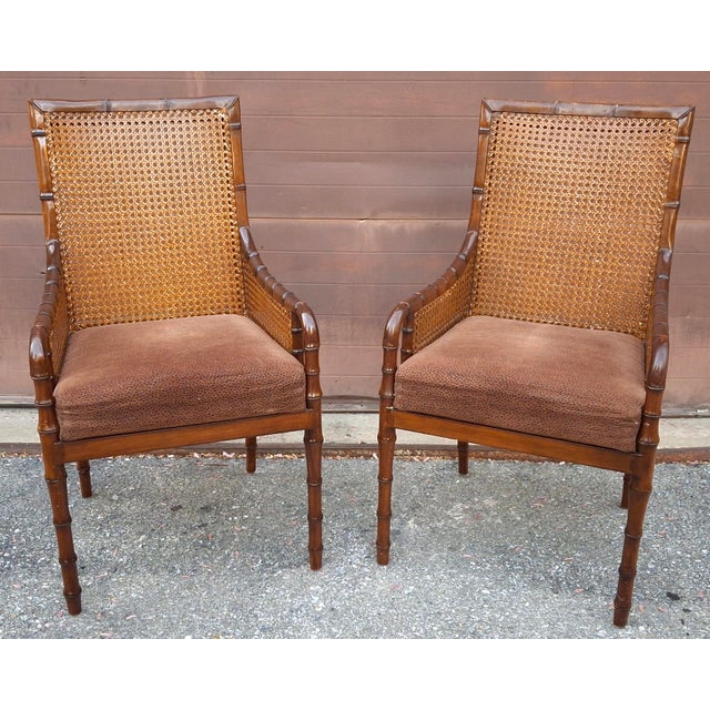 Palecek Mid-Century Modern Hollywood Regency style armchairs, characterized by their faux bamboo frames and double cane...