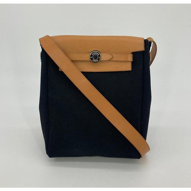 Hermes Herbag Tpm Mini Black and Beige Sangles Canvas in very good condition. Two bags in one with interchangeable...