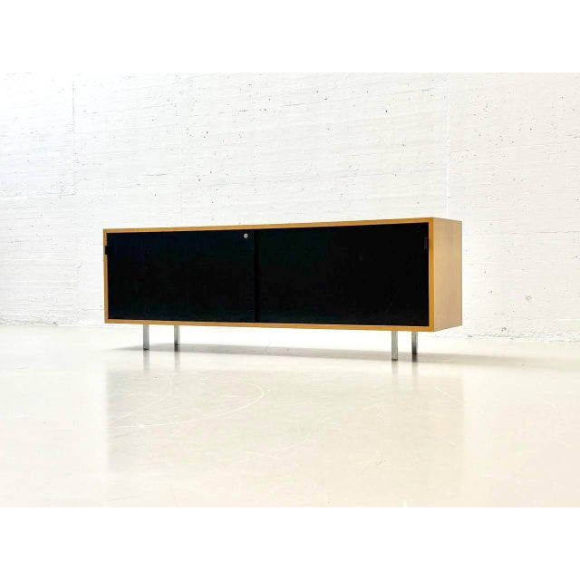 This elegant sideboard from knoll international impresses with its clean lines and high-quality craftsmanship. made of...